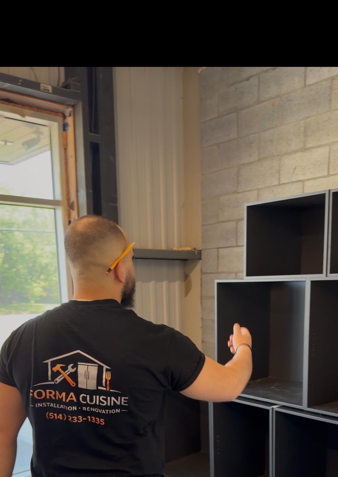 Forma Cuisine craftsman installing custom cabinetry